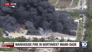 Large warehouse fire burns in northwest Miami-Dade