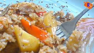 SPICY-SWEET RICE WITH VEGETABLES AND CHICKEN in a WOK pan.