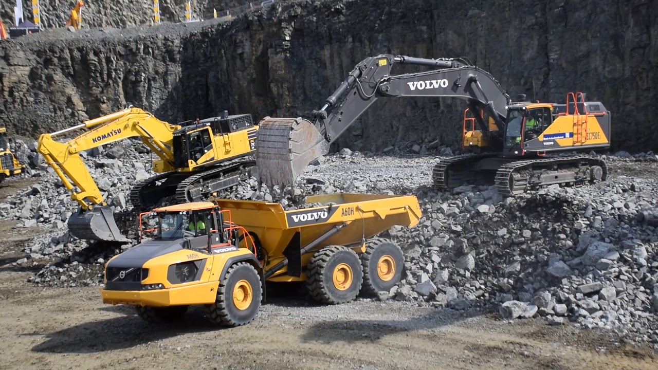 Volvo EC 750E excavator loads Volvo A60H articulated dumper - YouTube