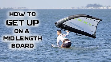 How to get up on a mid length board