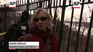New York city residents gathered nearby the commuter train derailment Sunday, to see what happened o