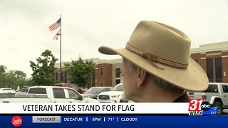 Veteran takes stand for flag