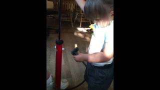 Little Girl Using Air Pump On Tummy Little Girl Using Air Pump On Tummy
