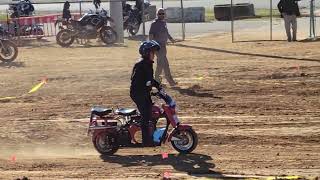 Steve Lorenz rides a Cushman on a dirt track endurance course