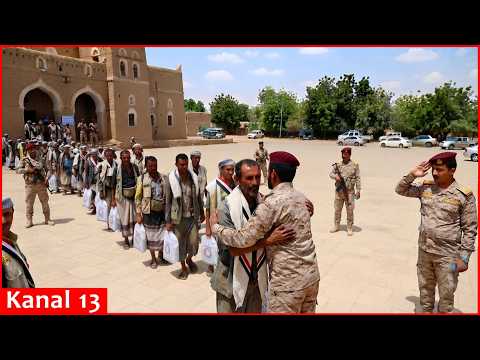 People identified by Houthis as freed prisoners arrive in Sanaa