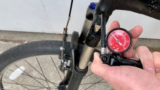 How to put air in a bike fork
