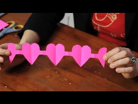 How do you cut a chain of paper dolls?