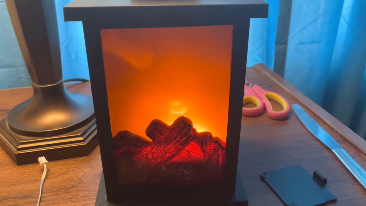 Greyson Home Decorative LED Tabletop Fire Lantern from Bed Bath and Beyond. I bought the small one.