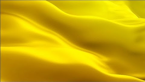 Gold flag video waving in wind. Realistic golden Flag background. Gold Flag Looping Closeup 1080p