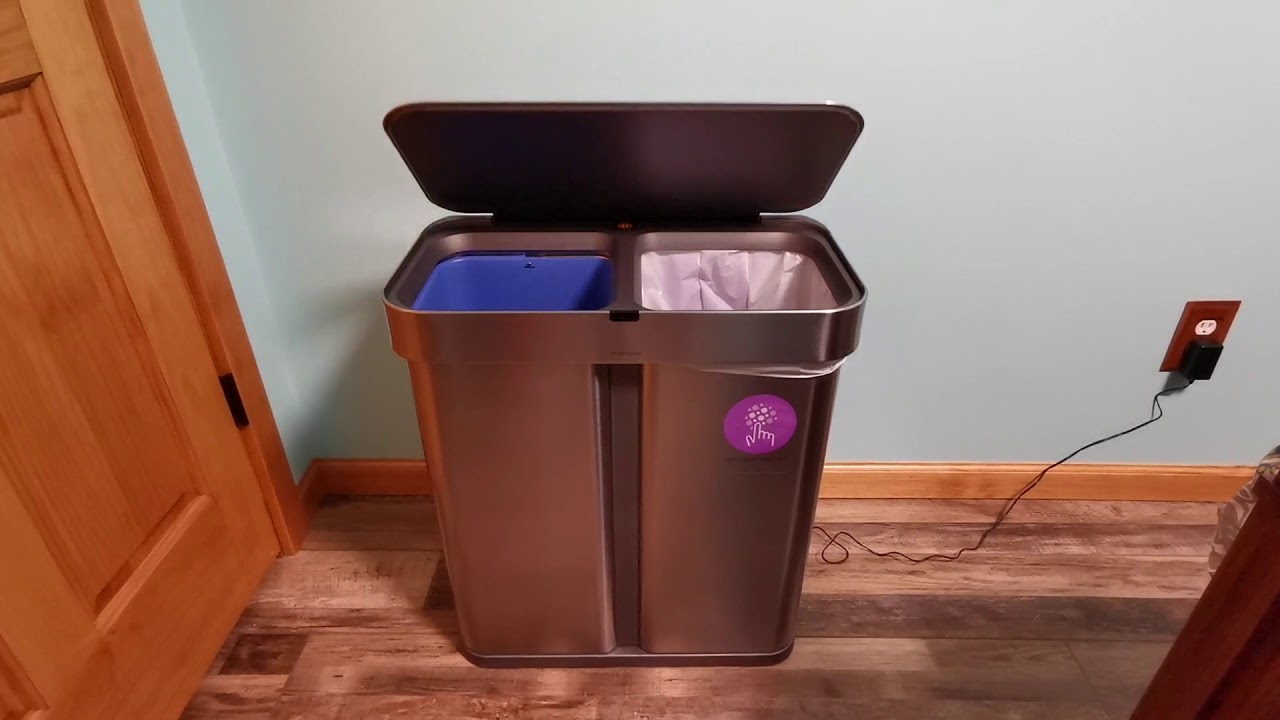 Simple human dual compartment trash bin.