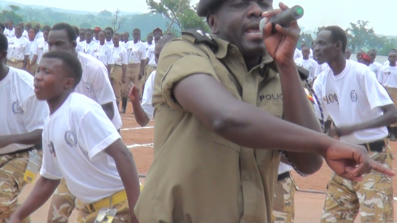 Afande OJ Preforming a song for HE at Kabalye Police Training school