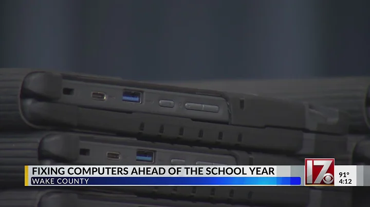 Fixing computers to give to students ahead of the Wake County school year