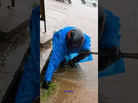A Heavy Rain Flooded Street Cleaning the Trash On Drain #shorts