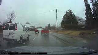 Dashcam footage of yet another oblivious driver pulling out in the rain