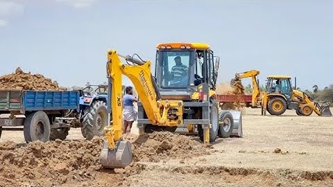 Mahindra and JCB 3dx Machine Loading Mud in Powertrac Mahindra Sonalika Swaraj Tractor for Road work