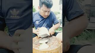 ????skill of cutting coconut with stainless knife. shorts knife coconut reels style