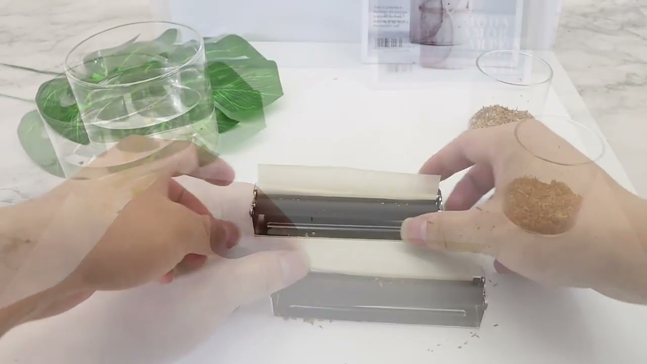 Máquina portátil para enrolar tabaco