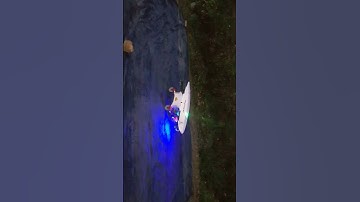 large quadcopter with ground robot take off at night