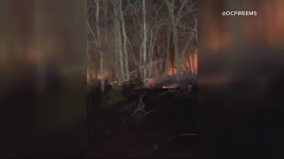 DC Fire and EMS firefighters battle with brush fire incited by strong winds