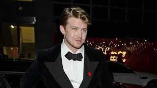 Joe Alwyn makes a Swift exit from the Dunhill pre BAFTA dinner as he piles into a taxi with Ellie Ba