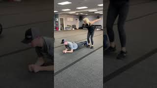Partner planks jump over