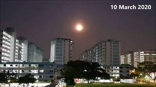 Train passing Singapore HDB Housing Estate with Super Full Moon