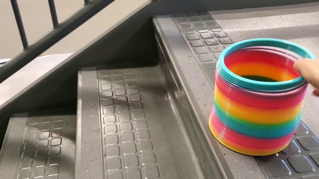 Giant Rainbow Slinky...will it ever make it down the steps? YouTube