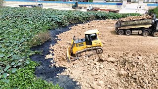 Shantui Bulldozer Pushing Mountain Rock Rolling Black Mud Filling Up Land Unloading From Dum Truck