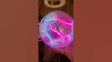 Tesla Coil with Plasma Toroid Generator and a Lithium Doped Xenon Sphere