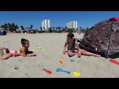 Kids are playing on the beach with sand and having fun