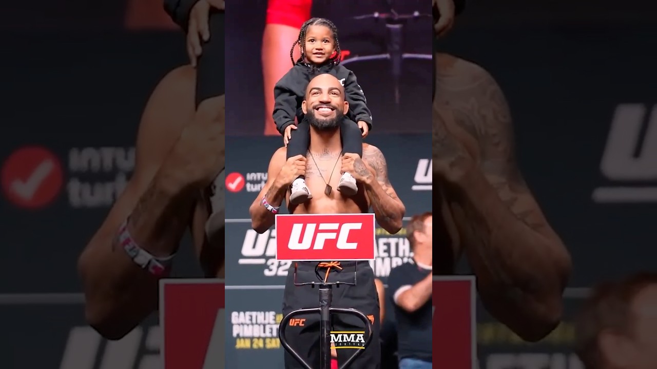 Charles Johnson brings out his daughter to the 