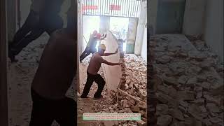 Workers Push Wall Demolition Gone Right