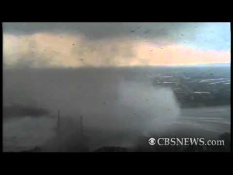 Funnel cloud forms over river