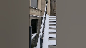 Removing Slippery Snow From Handrail