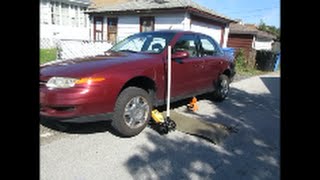 Putting up a muffler heat shield on a 2002 saturn l200