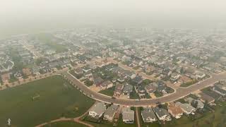 Flying around a smoky Fort McMurray, Alberta.  Timberlea, Thickwood, Wood Buffalo