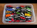 Big box filled with lots of cars of different types