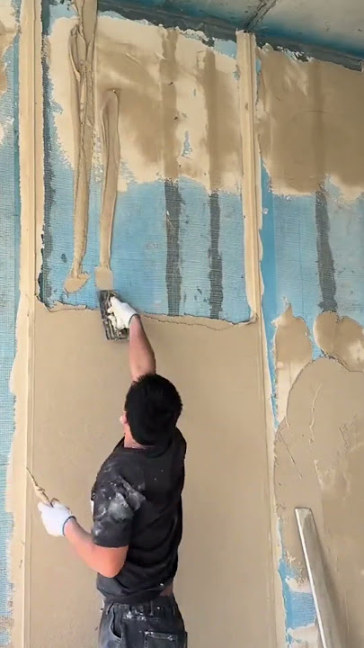 the stage of throwing cement mixture on the high part during the plastering stage