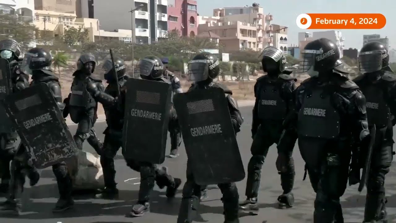 ⁣Senegalese protesters clash with police over election delay | REUTERS