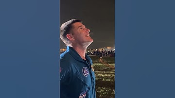 Canadian astronaut Jeremy Hansen looks on as NASA’s Space Launch System (SLS) rocket