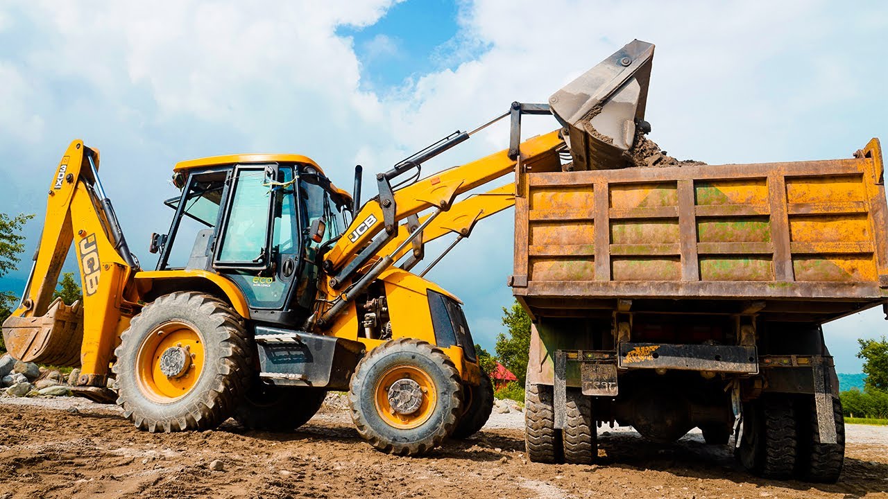 Jcb 3dx Backhoe Machine Loading Sand into Dump Trucks