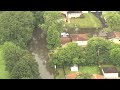 Suburban streets SUBMERGED in water after heavy rainfall