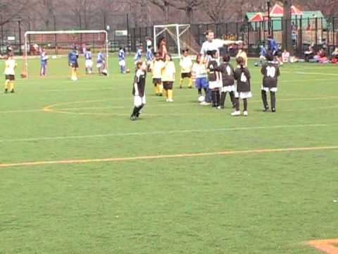 Saja playing soccer for the AYSO team at Caton Park. Her team one this game. Her first year of soccer.