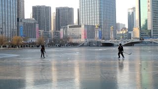 Ice hockey and skating on the Haihe River Tianjin China winter sports 海河溜冰打冰球