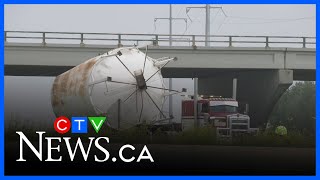 Officials assessing overpass damaged by semi