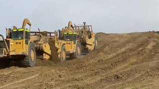CAT 651E and 657E Hauling Dirt