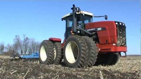 Versatile 305 Tractor pulling a DMI chisel plow in Illinois