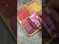 Filling platter with pink sweets 