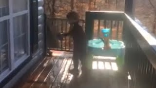 Conner splashing outdoor fun with water table