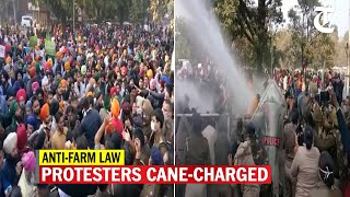 Police use water cannon and cane-charge anti-farm law protesters near the Sector 33 BJP office